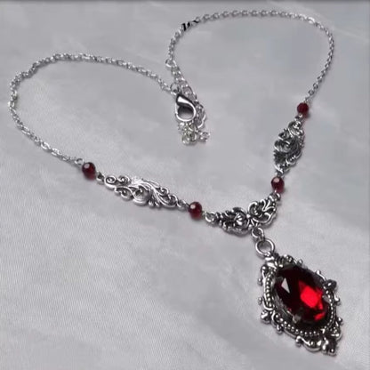 Mrs. Claus Necklace - Silver w/ Red Gem