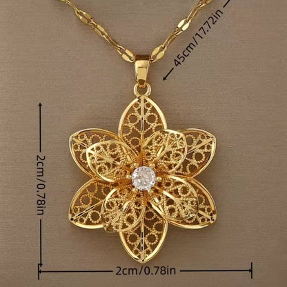 Mrs. Claus Necklace - Gold Rotating Poinsettia