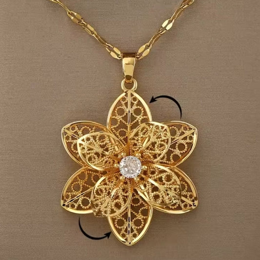 Mrs. Claus Necklace - Gold Rotating Poinsettia